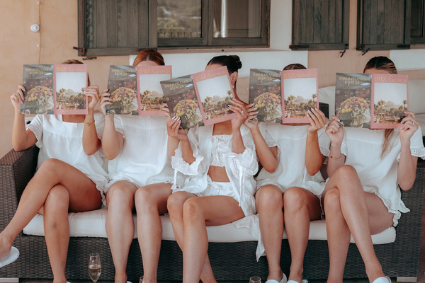 Bride and bridesmaids each reading a wedding zine