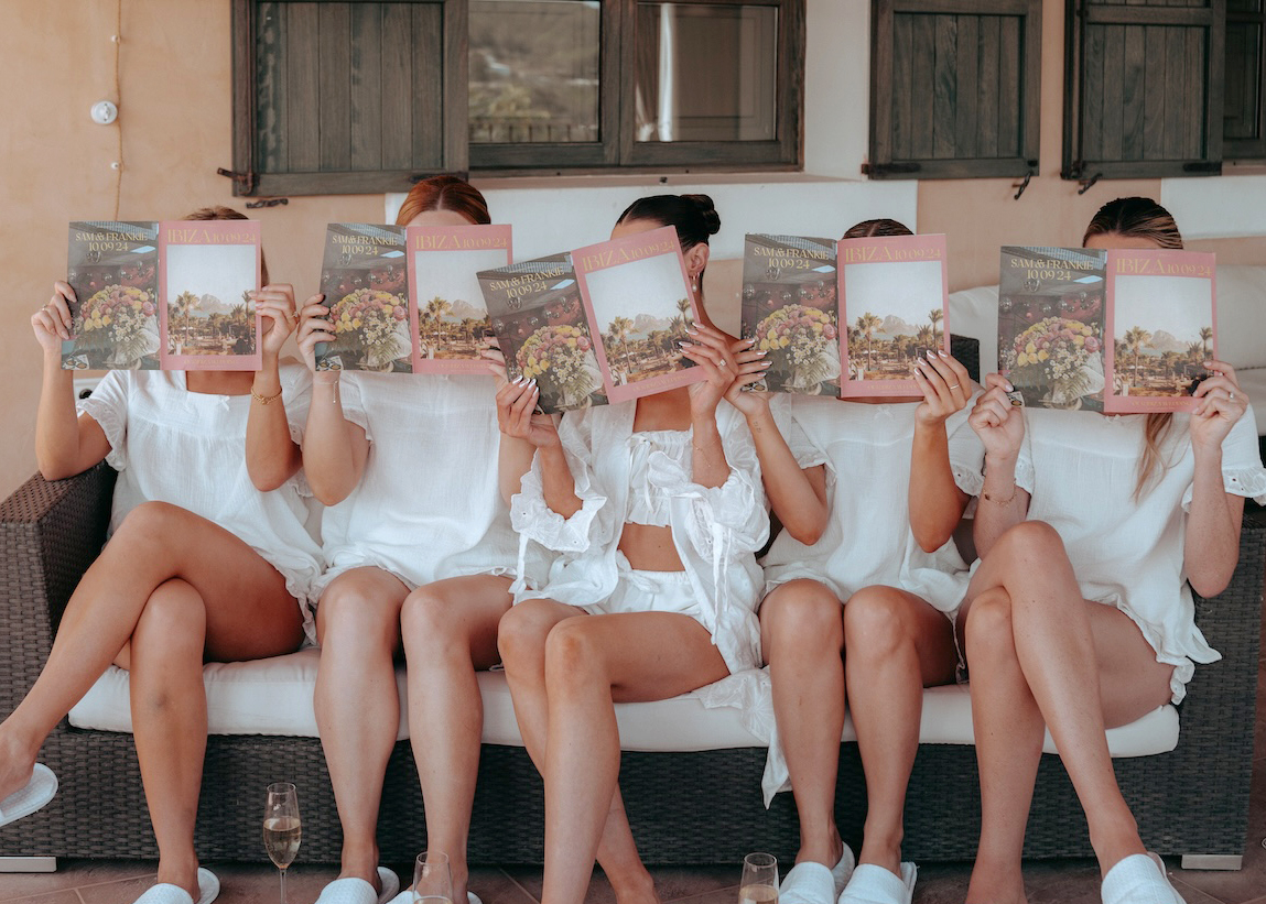 Bride and bridesmaids each reading a wedding zine